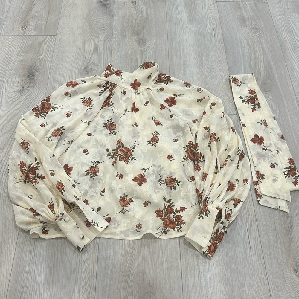 RED DRESS floral blouse with bow tie in the back. Never worn.